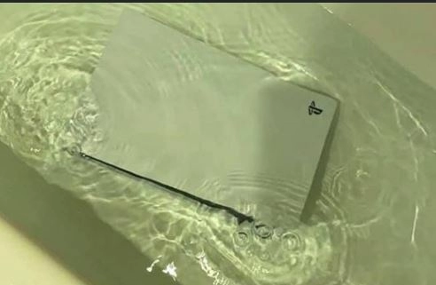 PS5 in a bathtub full of water